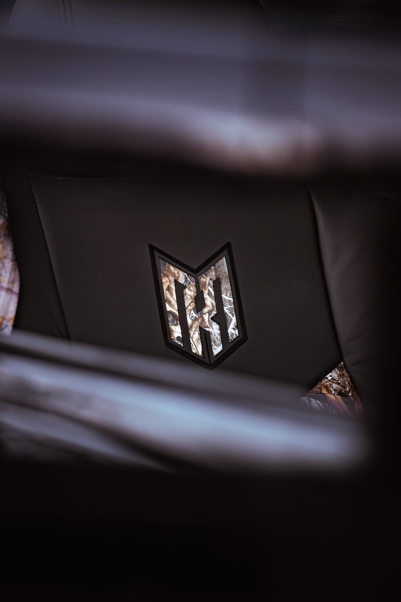 Camo Crest Tee — chest crest close-up, Realtree inlay